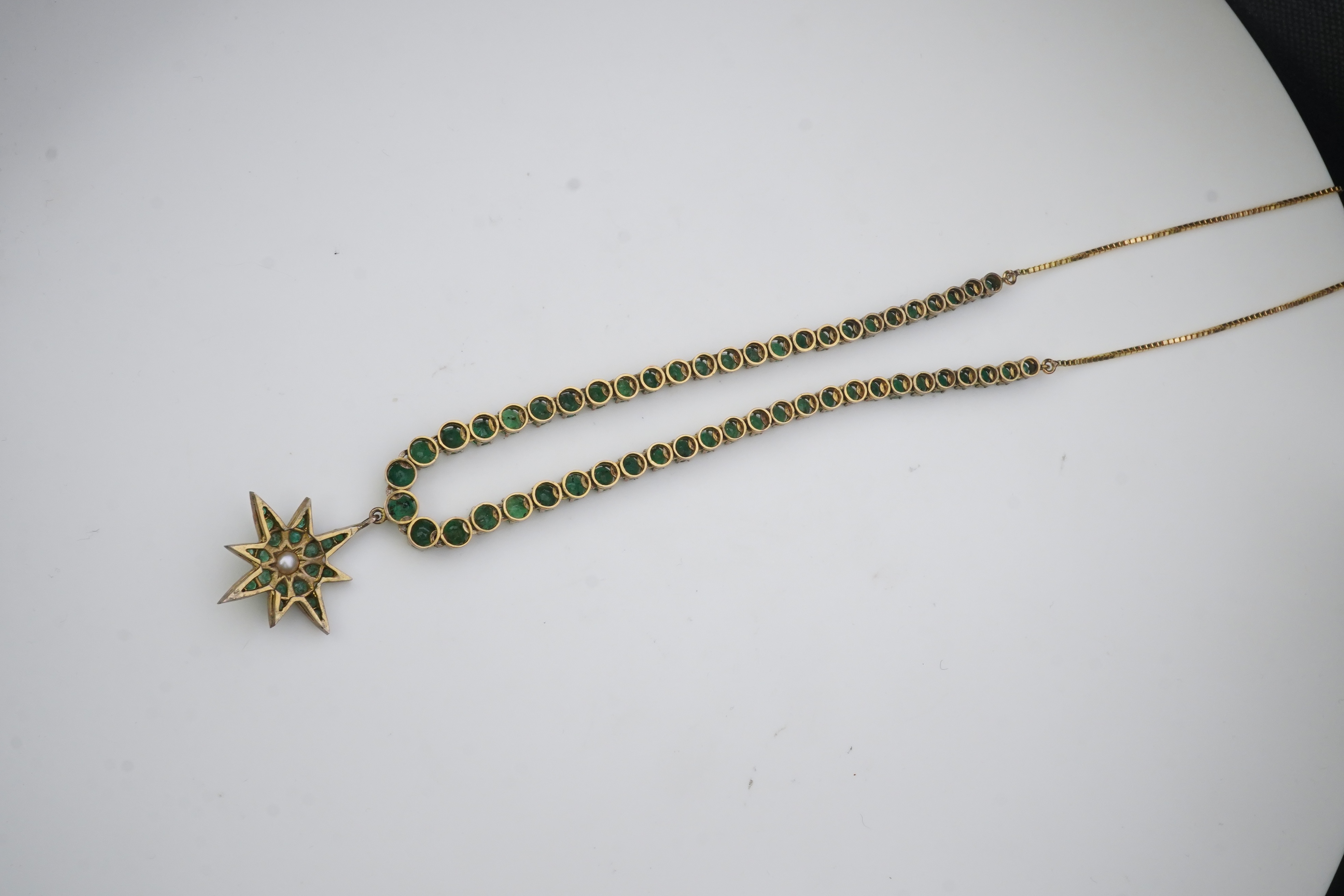 An emerald and pearl necklace